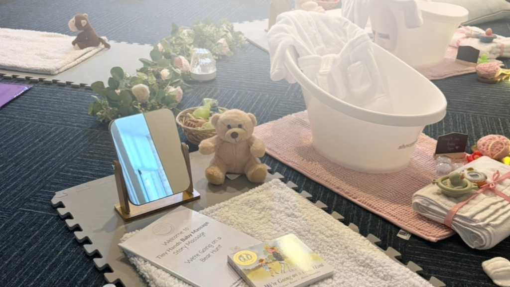 Tiny Hands Baby Massage and Spa set up with Shnuggle bath, soft blankets, dressing gowns, towels and story massage. Image accompanying the Baby Massage FAQs